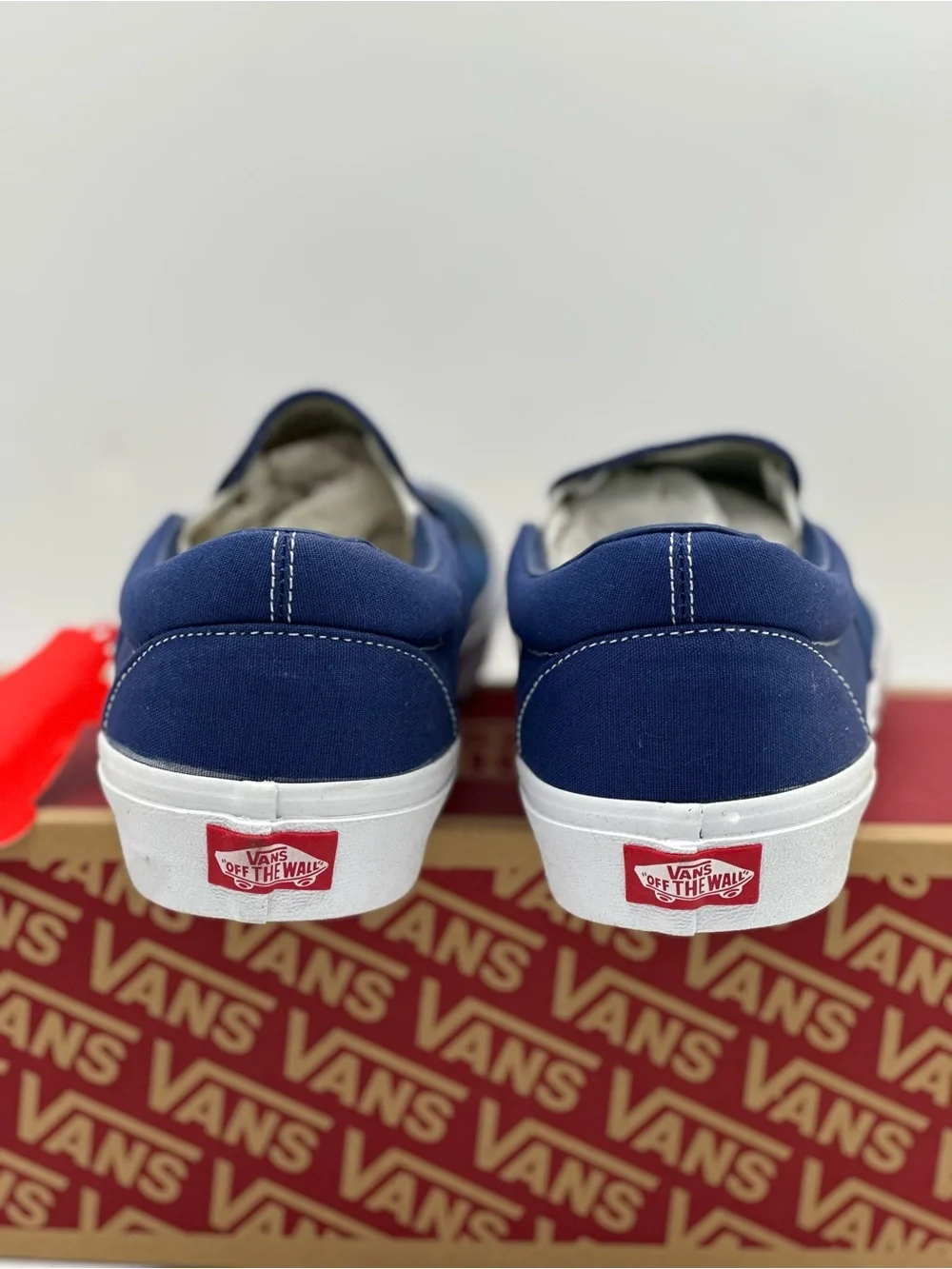 Vans Blue Plaid Slip-On Sneakers with Orange Accent